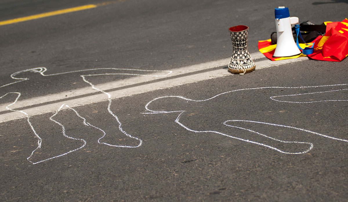 A protest with two chalk outlines of bodies were drawn on the street