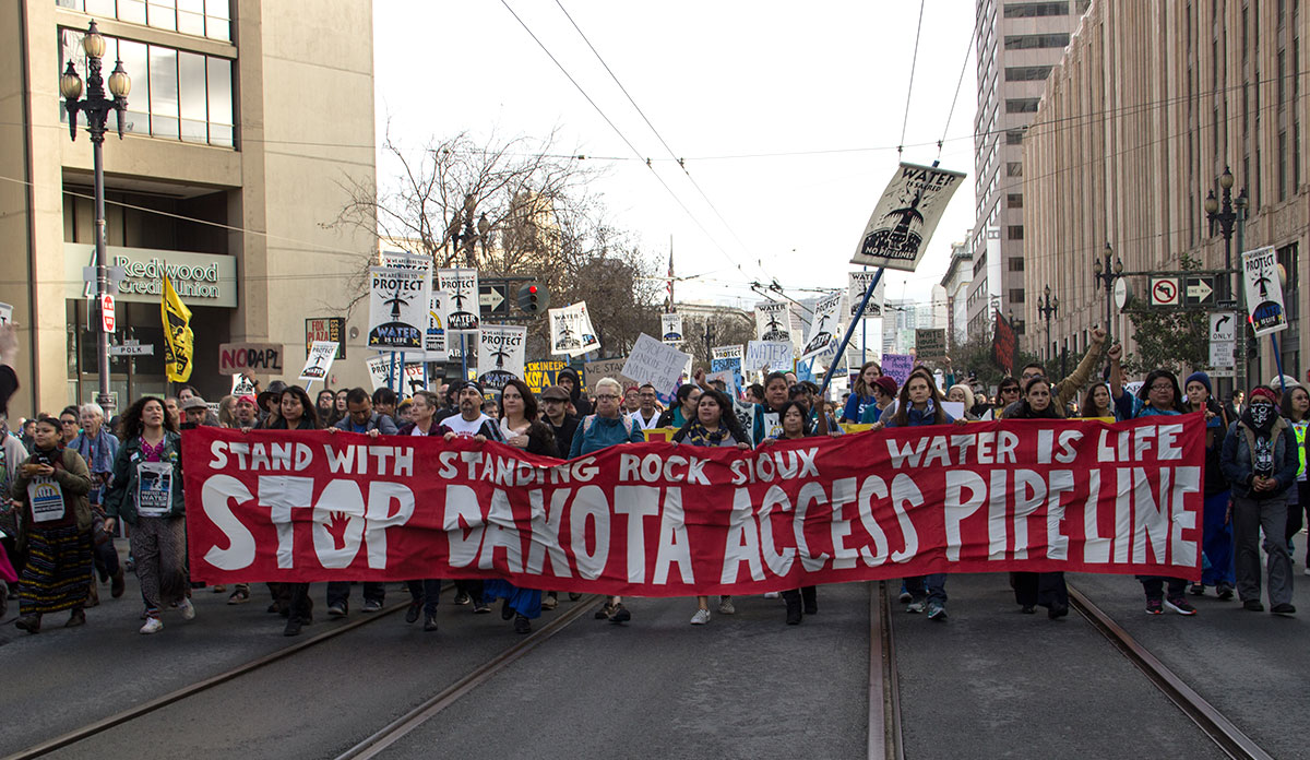 Protesters carrying a banner saying Stop Dakota Access Pipeline