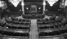 Empty black and white legislative chamber at the Illinois state capitol