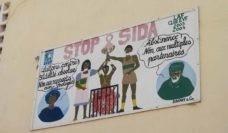Photo of a painted wall mural in Senegal saying "Stop SIDA"