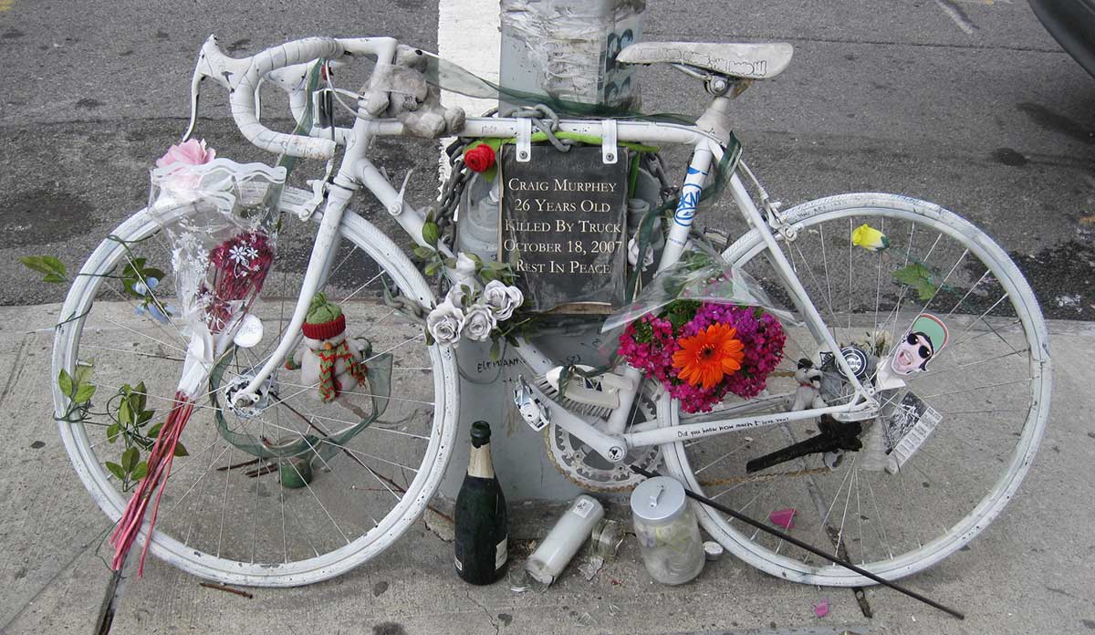 "Ghost bike" memorial with flowers and candles