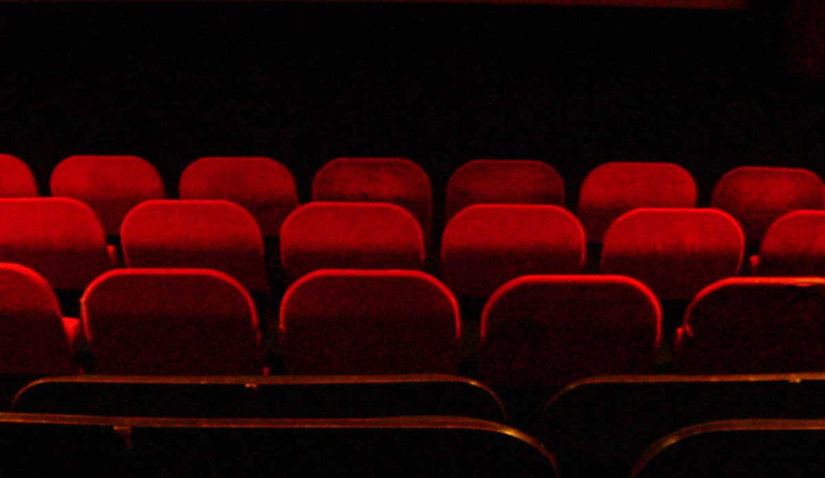 Red velvet seats inside a movie theater