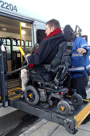 Nick Crow boarding a RIDE van