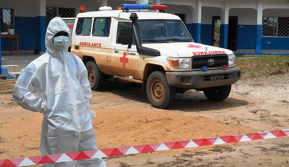 An Ebola burial worker and vehicle in Bombali, Sierra Leone.