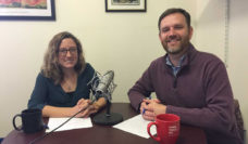 Public Health Post Fellow Madeline Bishop and editor-in-chief David Jones sitting at a table