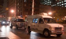 Television news vans at night