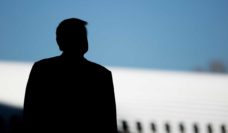 Silhouette of Donald Trump in front of Boeing aircraft