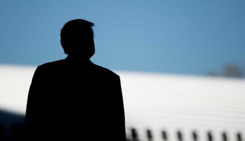 Silhouette of Donald Trump in front of Boeing aircraft