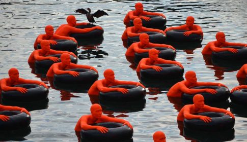 (SOS) Safety Orange Swimmers, a floating public art installation in Fort Point Channel, Boston