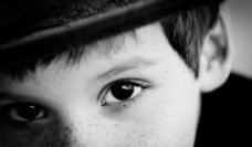 Black and white closeup of a boy's eyes