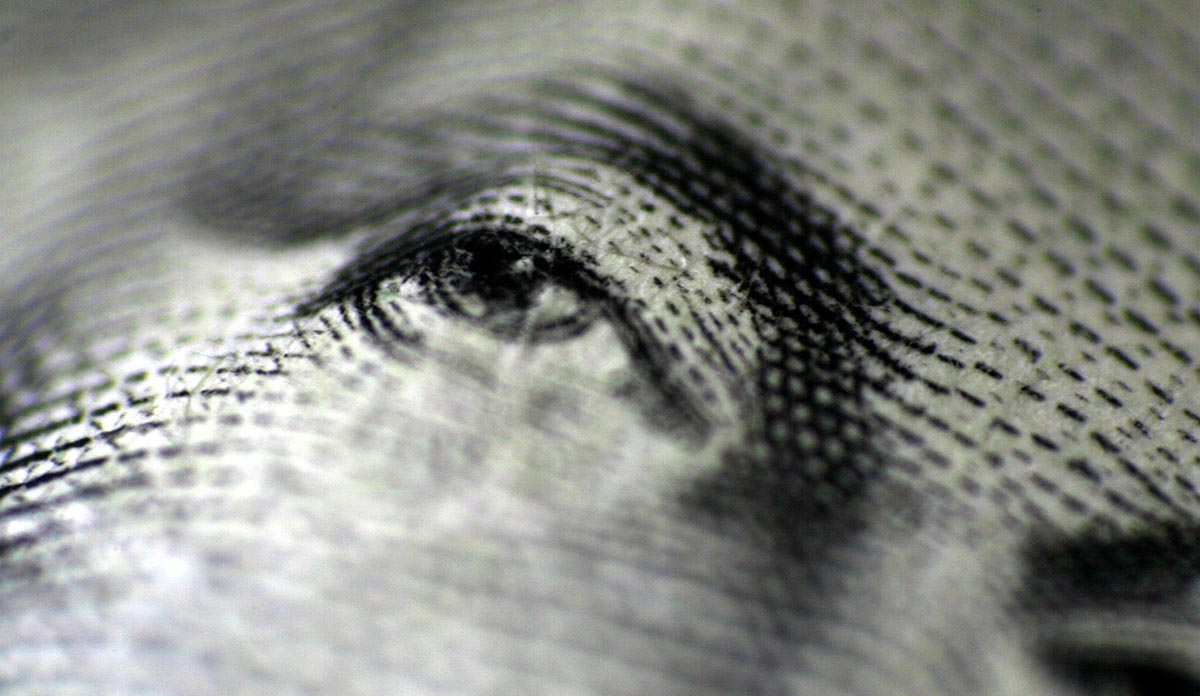 Closeup of George Washington's eyes on a dollar bill