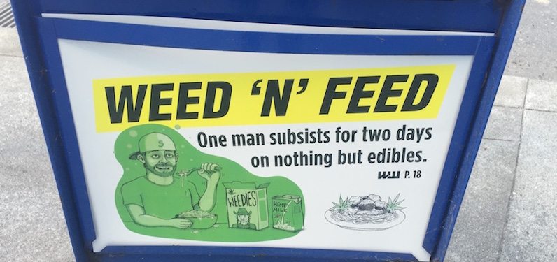 Marijuana edibles advertising on a newspaper kiosk