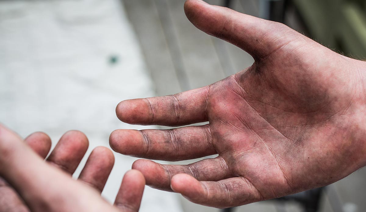 Hands showing dirt from manual labor