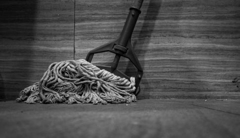 A black and white photo of a mop