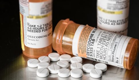 Prescription bottles for oxycodone with pills
