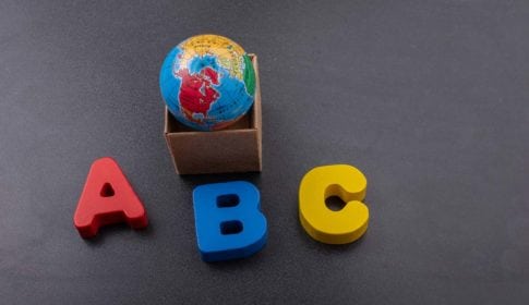 The letters A, B, C and a globe in a box