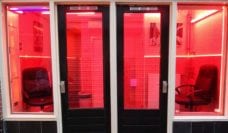 Two empty chairs in a window in Amsterdam red light district