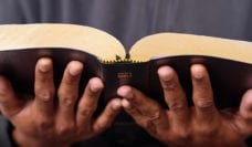 Hands holding Bible