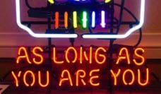 Neon sign saying "As Long As You Are You"