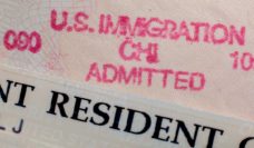 Closeup of part of a stamp saying US Immigration, and Resident