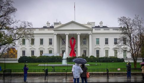 White House with a red AIDS ribbon hanging on the front