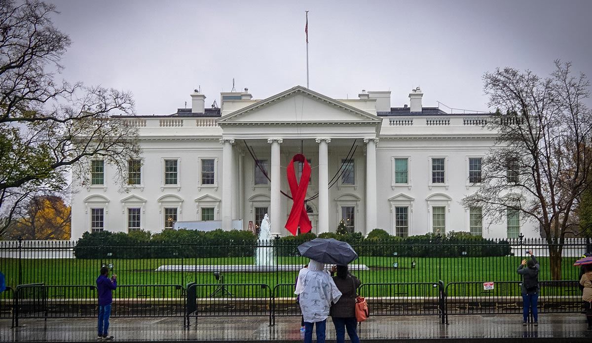 White House with a red AIDS ribbon hanging on the front