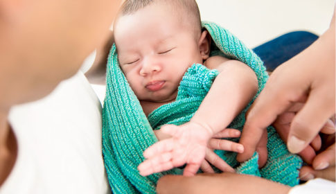 baby wrapped in towel