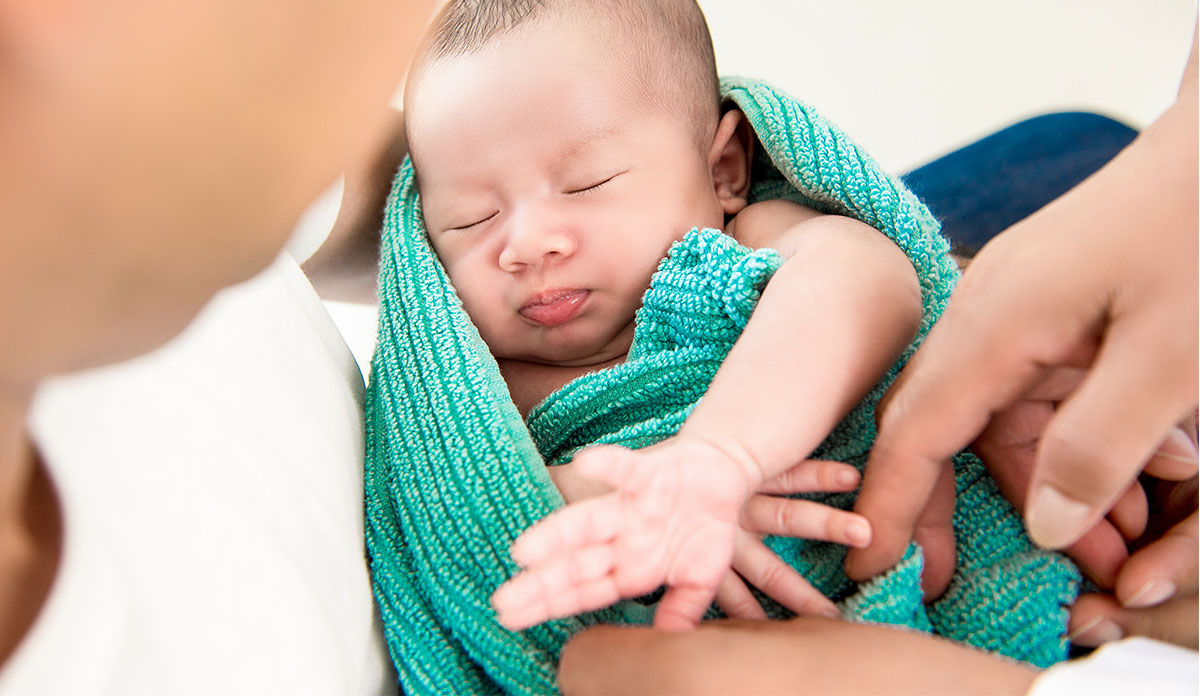 baby wrapped in towel