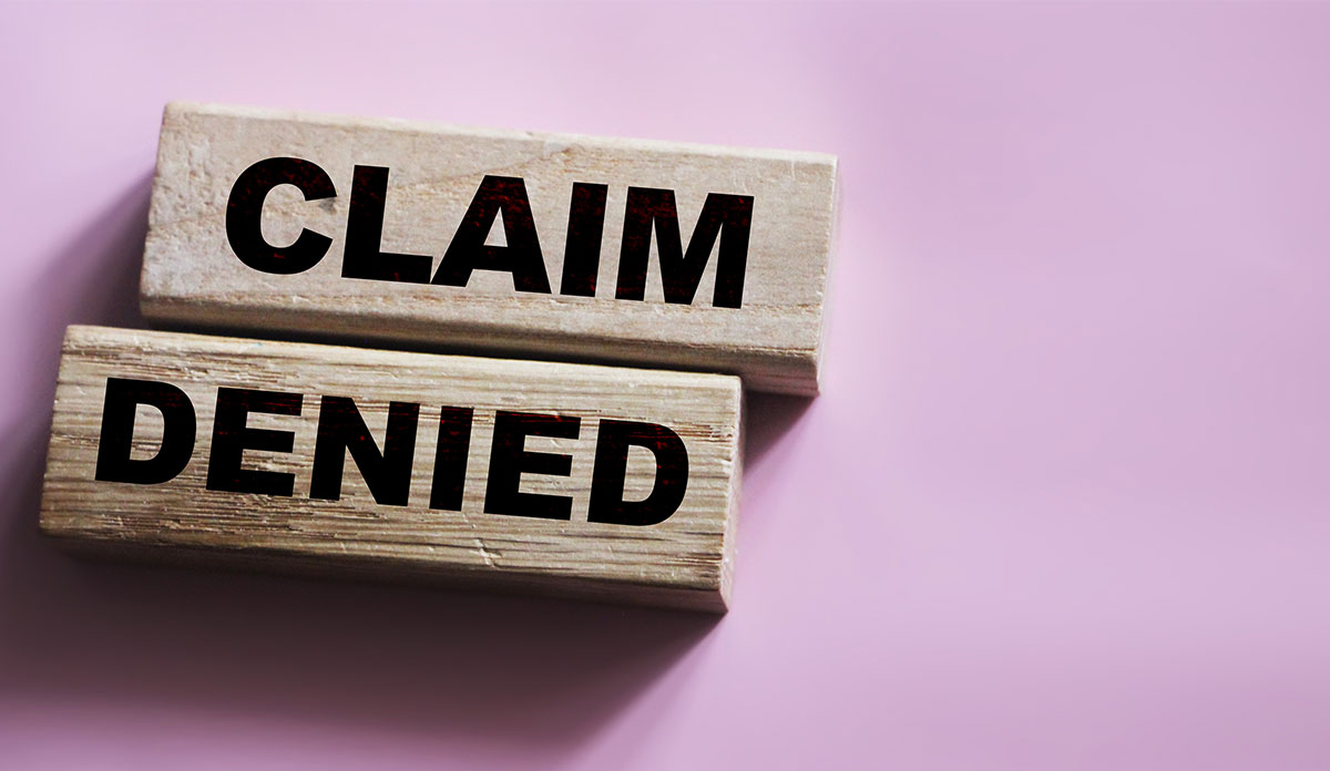 claim denied on pink background