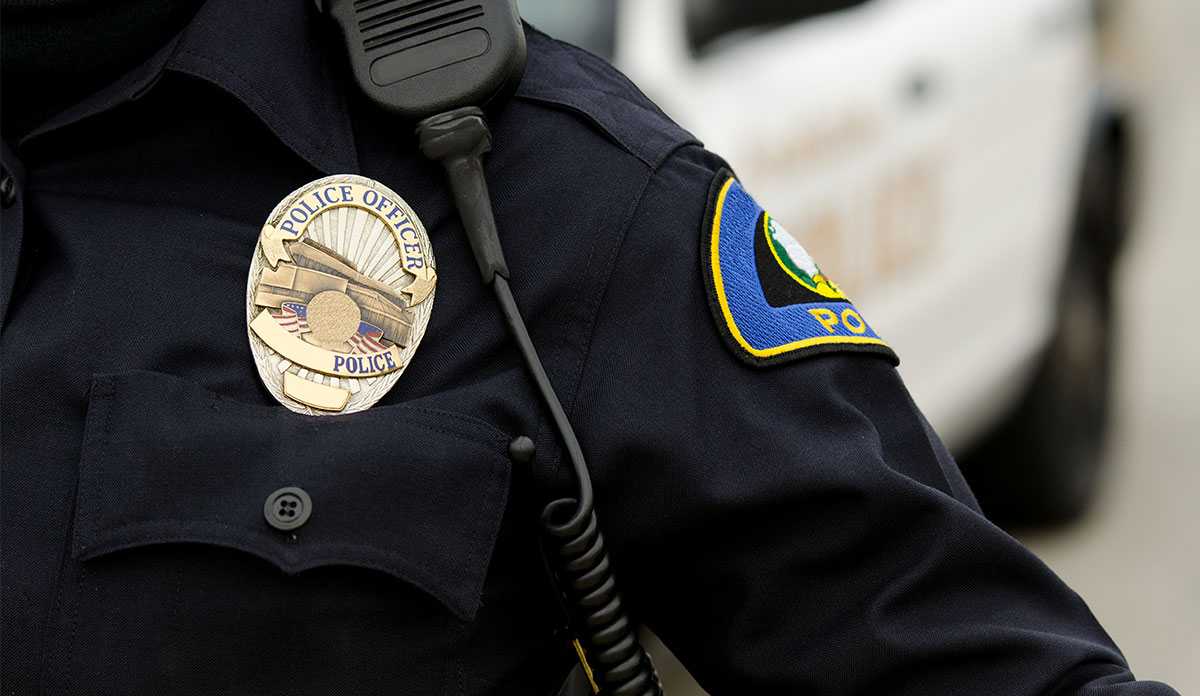 badge and radio of police officer