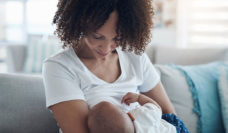 woman breastfeeding baby