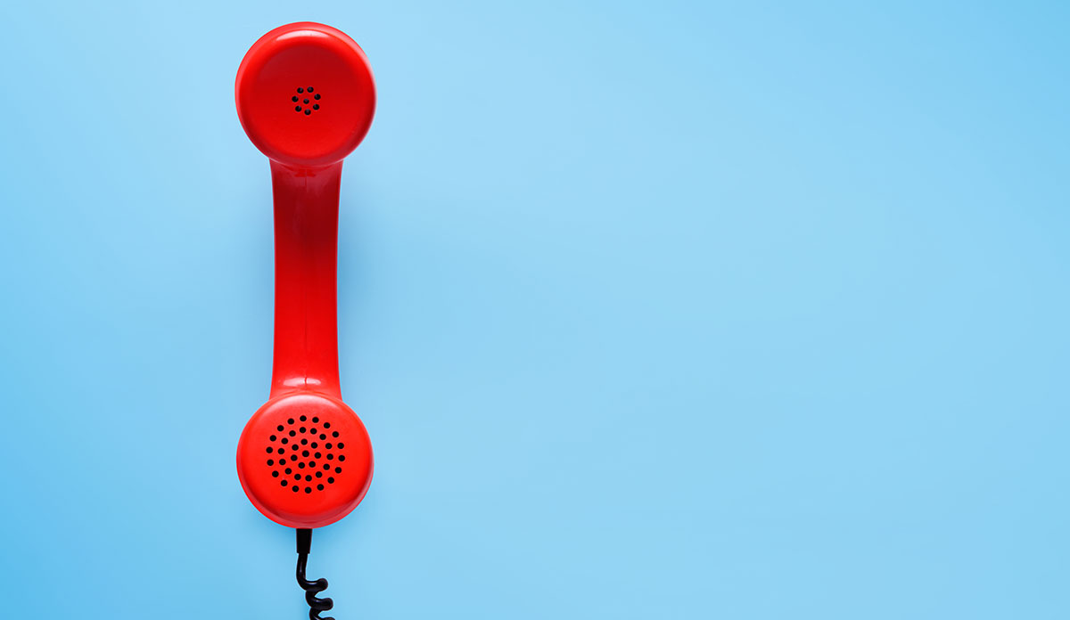 red telephone on blue background