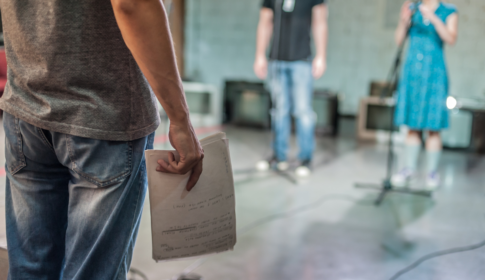 three people rehearse for their upcoming production