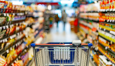 grocery cart in grocery aisle