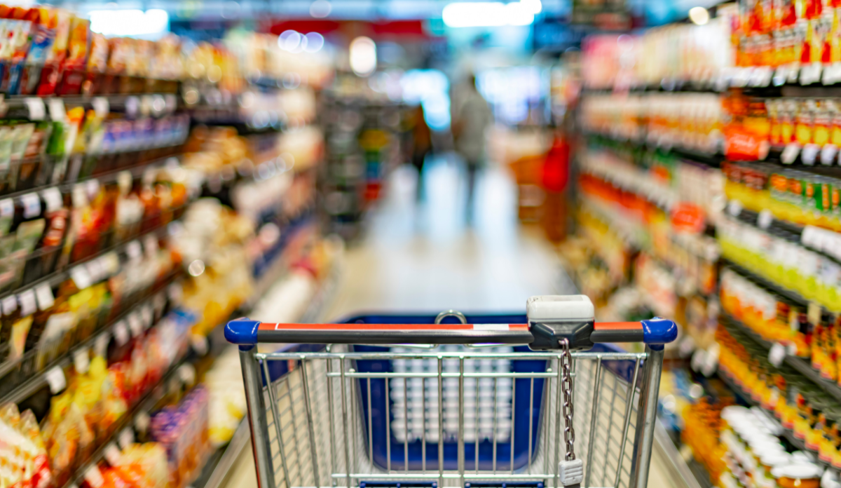 grocery cart in grocery aisle