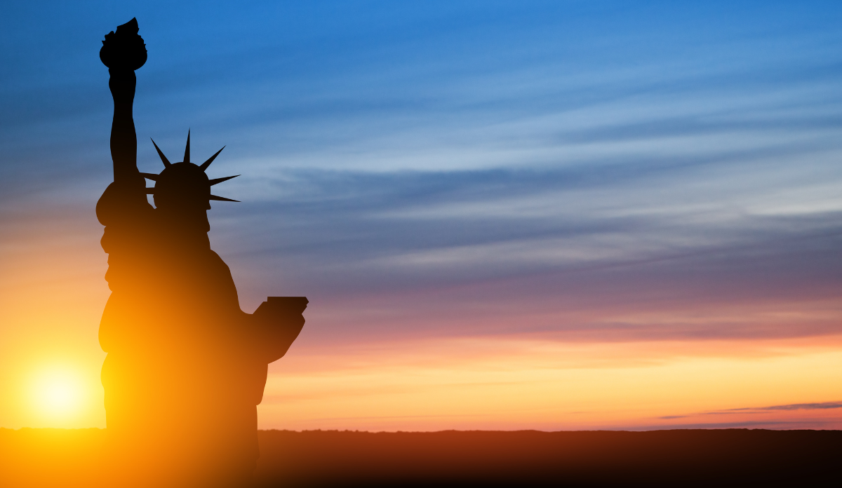 Statue of Liberty on background of sunset sky